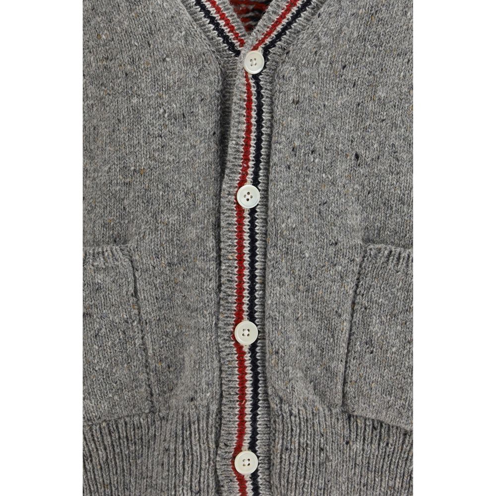 Cardigan by Thom Browne for men in merino wool & mohair gray, signature, patchwork & striped showcases a captivating silhouette, artfully detailed with a captivating and v-neck neckline for a truly sophisticated captivating look.