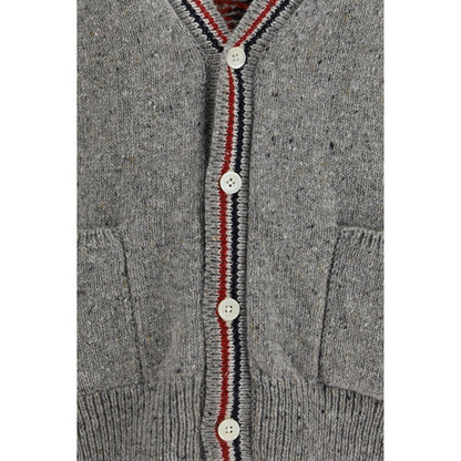 Cardigan by Thom Browne for men in merino wool & mohair gray, signature, patchwork & striped showcases a captivating silhouette, artfully detailed with a captivating and v-neck neckline for a truly sophisticated captivating look.