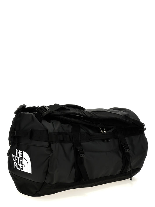 Small Travel Flap Backpack by The North Face for unisex in lyocell polyester mesh black features a fashionable silhouette, showcasing the Base Camp Duffel City Lyocell Polyester Mesh Small Travel Flap Backpack design with a secure flap & zipper, ample , and versatile backpack-strap, adjustable-strap & handle.