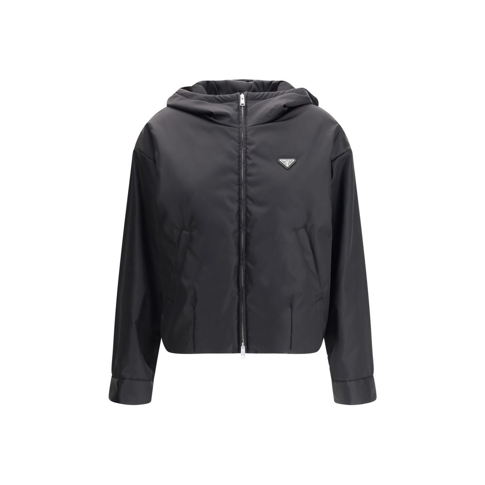 Hooded Windbreaker Jacket by Prada for women in nylon black presents a resilient silhouette, artfully detailed with a sophisticated hooded neckline and functional pockets, hooded & windproof for a resilient finish.