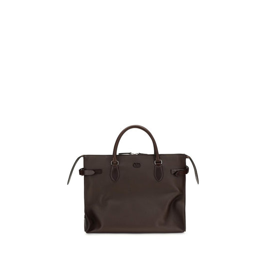 Large Shoulder Bag by Valentino Garavani for men in bos taurus calfskin leather brown & signature features an effortlessly chic silhouette with a secure magnetic & buckle, ample , and versatile shoulder-strap, handle, adjustable-strap & detachable-strap for effortlessly chic everyday luxury.