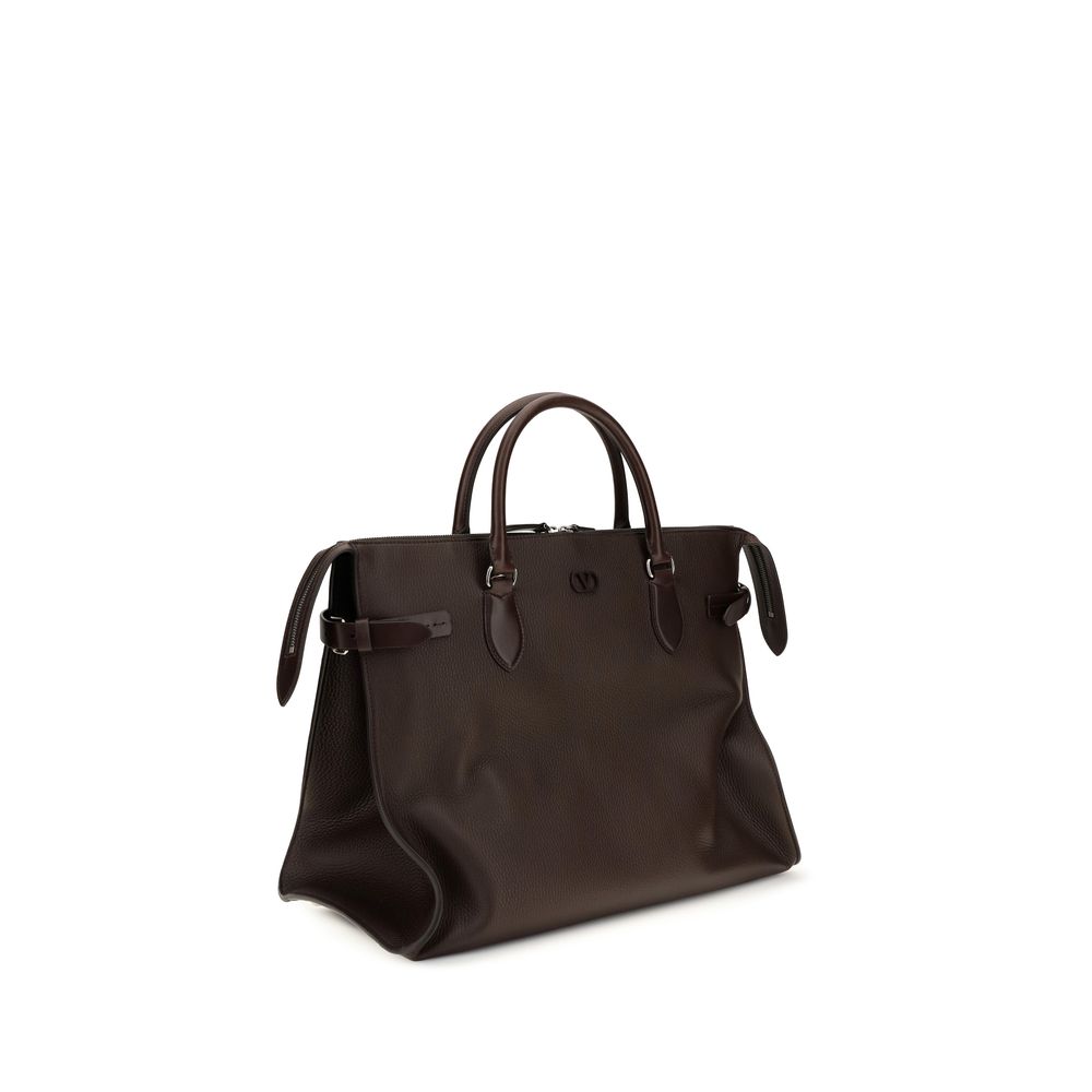 Large Shoulder Bag by Valentino Garavani for men in bos taurus calfskin leather brown & signature features a enviable silhouette, showcasing a secure magnetic & buckle, ample , and enviable shoulder-strap, handle, adjustable-strap & detachable-strap for a enviable finish.