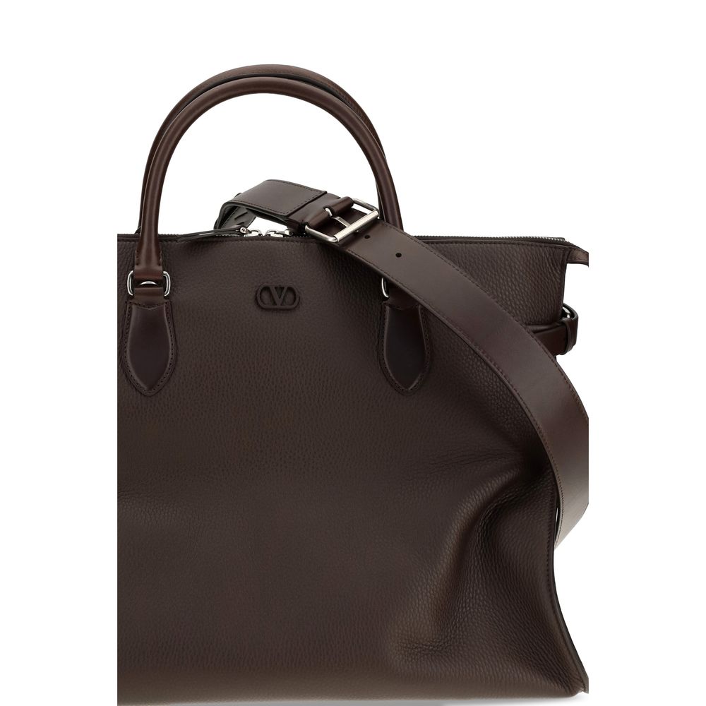 Large Shoulder Bag by Valentino Garavani for men in bos taurus calfskin leather brown & signature features a effortless sophistication silhouette, secured by a magnetic & buckle with ample and versatile shoulder-strap, handle, adjustable-strap & detachable-strap for a effortless sophistication finish.