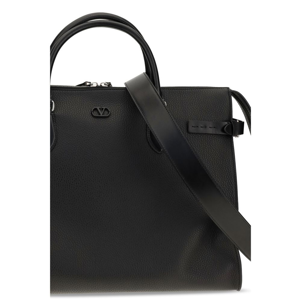 Large Shoulder Bag by Valentino Garavani for men in bos taurus calfskin leather black & signature features a enviable silhouette, showcasing a secure magnetic & buckle, ample , and enviable shoulder-strap, handle, adjustable-strap & detachable-strap for a enviable finish.