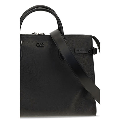 Large Shoulder Bag by Valentino Garavani for men in bos taurus calfskin leather black & signature features a enviable silhouette, showcasing a secure magnetic & buckle, ample , and enviable shoulder-strap, handle, adjustable-strap & detachable-strap for a enviable finish.