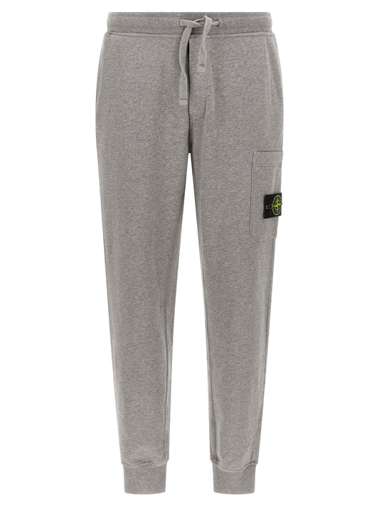 Jogger Sweatpants by Stone Island for men in cotton gray features an sporty tapered-leg with a and long, showcasing sporty .