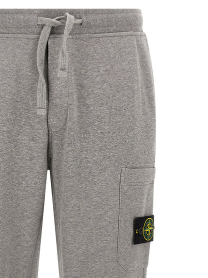 Jogger Sweatpants by Stone Island for men in cotton gray features an kinetic tapered-leg and long with a , showcasing high-performance for an kinetic look.