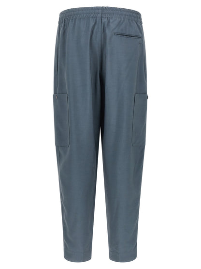 Joggers by Kenzo for men in wool gray, slate-gray & signature presents a refined pantology silhouette, artfully defined by a refined pantology , long, and a sophisticated .