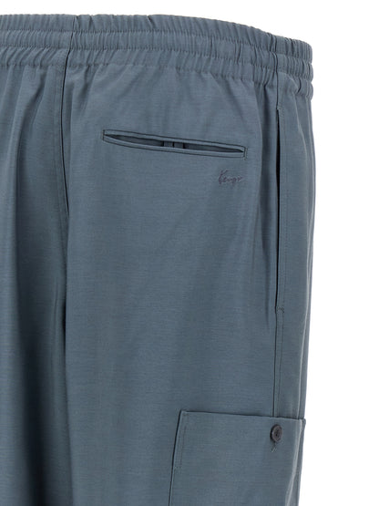 Joggers by Kenzo for men in wool gray, slate-gray & signature presents a tailored silhouette, showcasing a tailored and long cut with a refined for a truly tailored aesthetic.