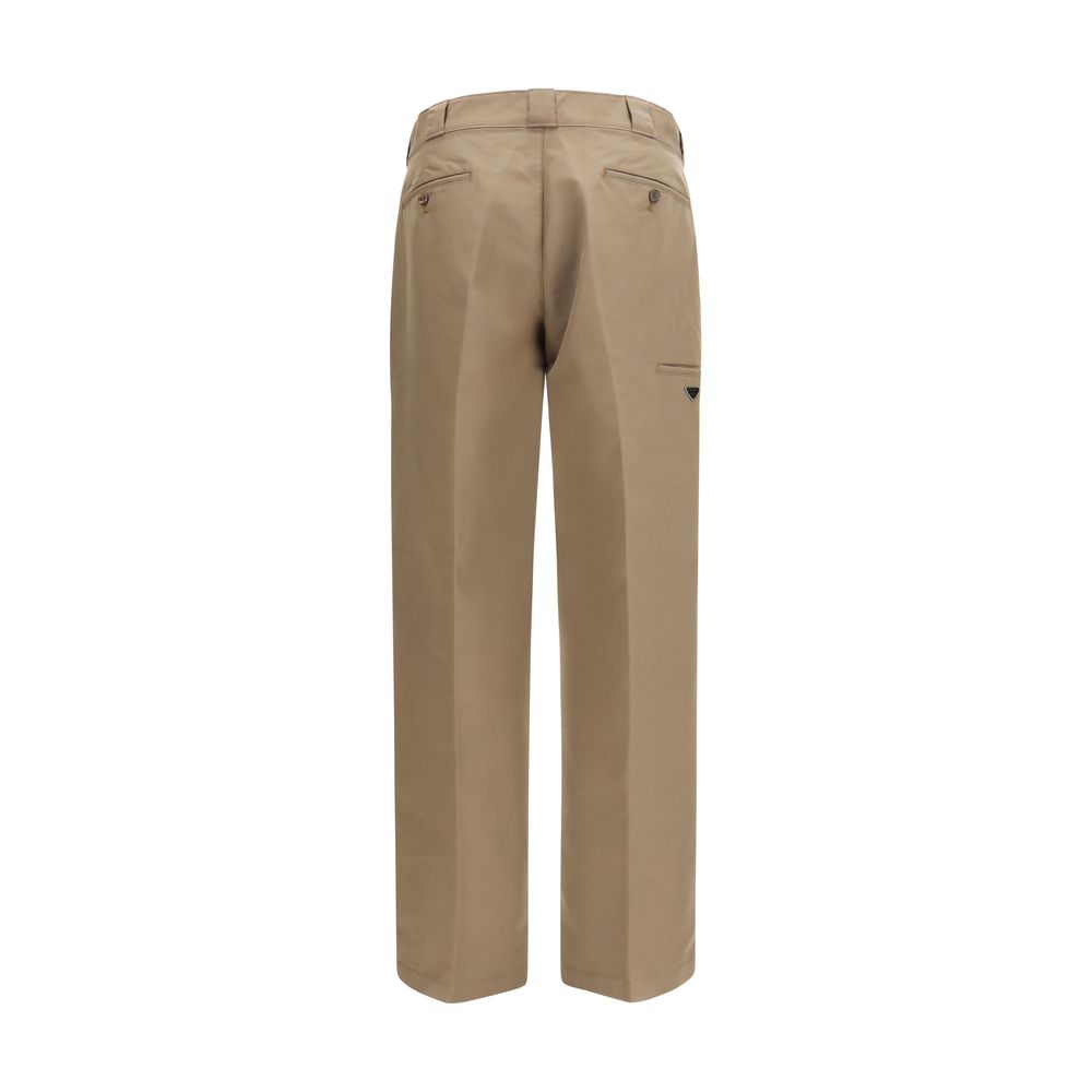 Casual Pants by Prada for men in polyamide cotton canvas brown & signature features an sartorial regular-fit, wide & oversized and long with a cut for a sartorial finish.
