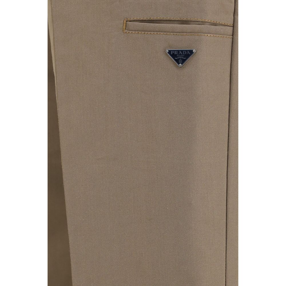 Casual Pants by Prada for men in polyamide cotton canvas brown & signature features an refined tailoring silhouette, showcasing a premium regular-fit, wide & oversized with a and long cut for a refined tailoring look.
