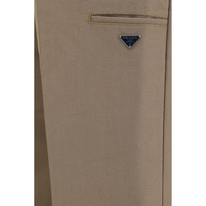 Casual Pants by Prada for men in polyamide cotton canvas brown & signature features an refined tailoring silhouette, showcasing a premium regular-fit, wide & oversized with a and long cut for a refined tailoring look.