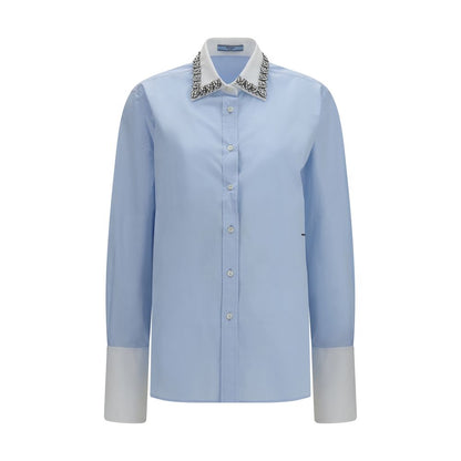 Dress Shirt by Prada for women in cotton blue showcases a sharp silhouette, elegantly detailed with a sharp and sharp long-sleeve.