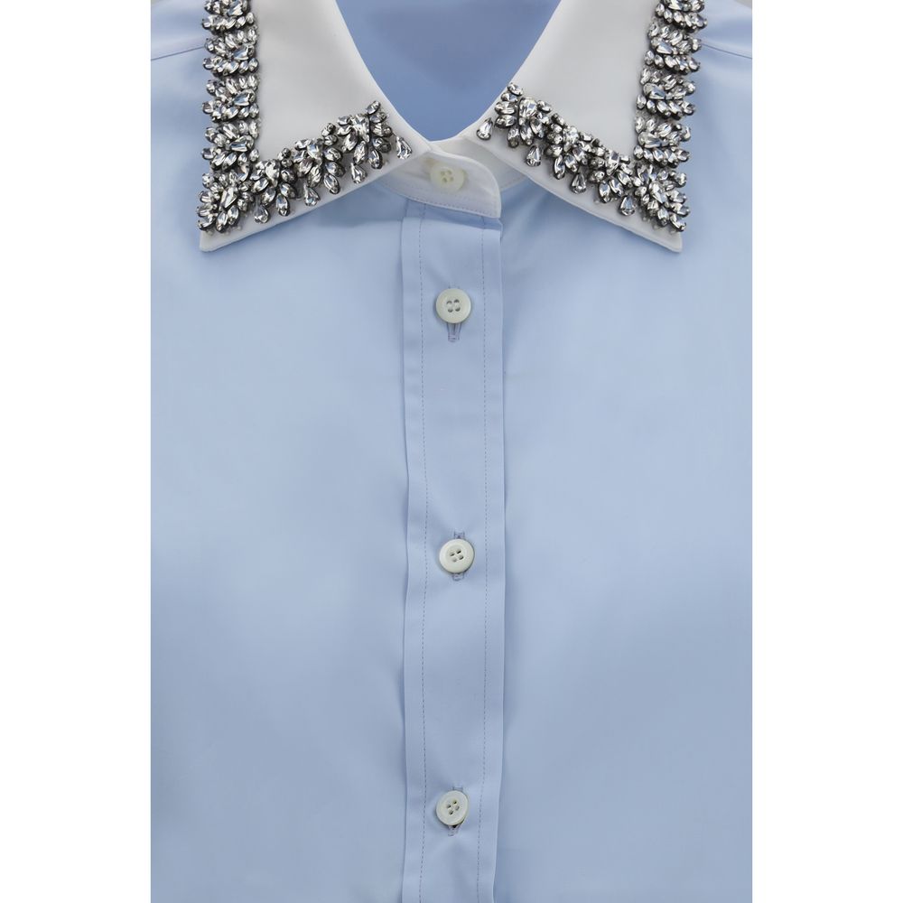 Dress Shirt by Prada for women in cotton blue showcases a sublime silhouette, artfully detailed with a sublime and for a sophisticated, sublime finish.