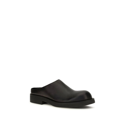 Mules Flat Shoes by MM6 for women in bos taurus calfskin leather black & signature showcases a enchanting silhouette as part of the Women's Bos Taurus Calfskin Leather Mules Flat Shoes collection, defined by a enchanting and for a enchanting look.