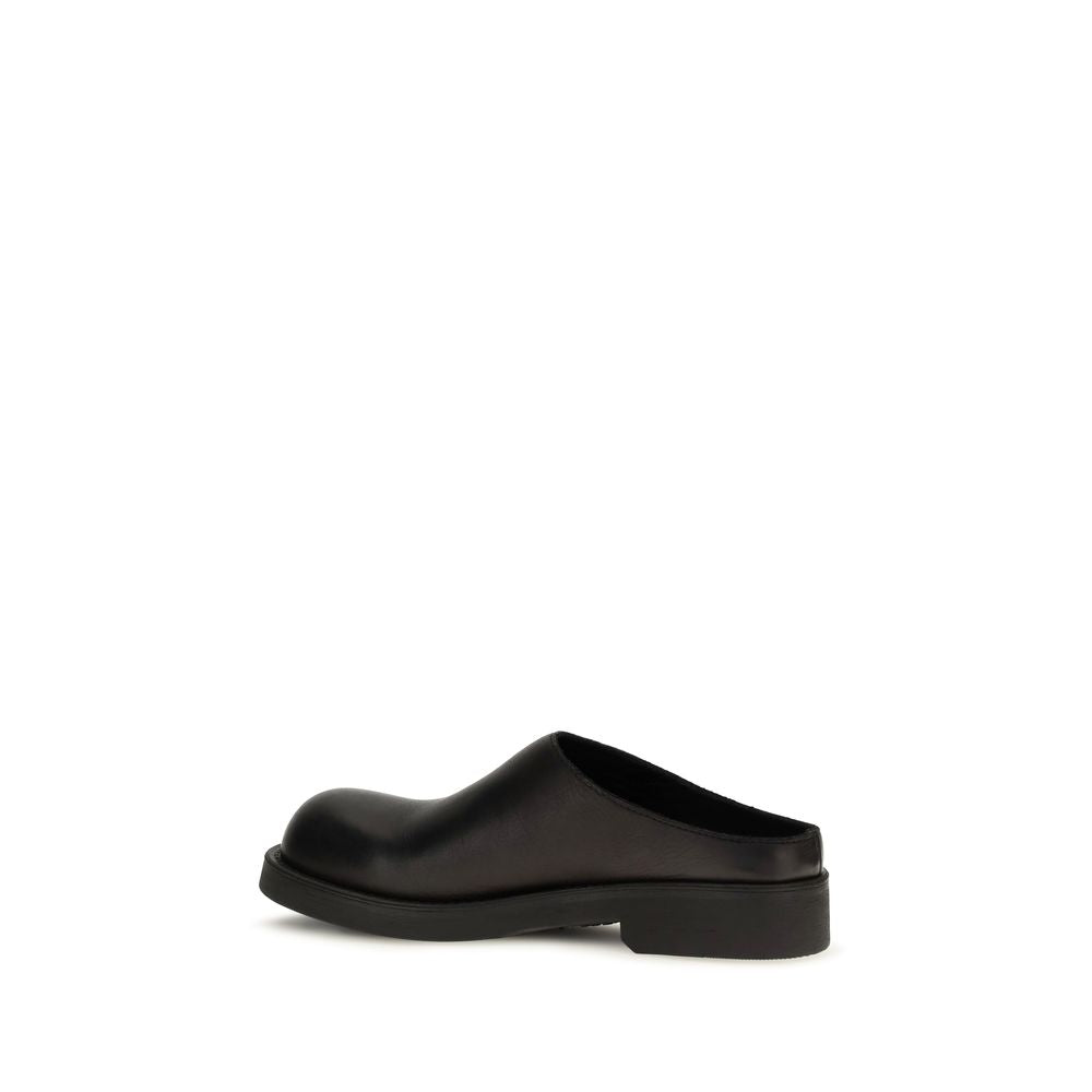 Mules Flat Shoes by MM6 for women in bos taurus calfskin leather black & signature features an captivating silhouette, showcasing the captivating style of the Women's Bos Taurus Calfskin Leather Mules Flat Shoes with its distinct and refined .