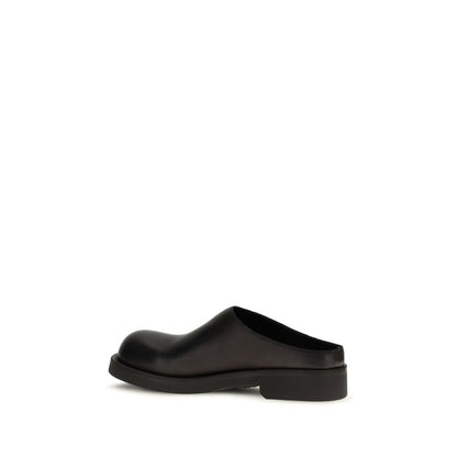 Mules Flat Shoes by MM6 for women in bos taurus calfskin leather black & signature features an captivating silhouette, showcasing the captivating style of the Women's Bos Taurus Calfskin Leather Mules Flat Shoes with its distinct and refined .