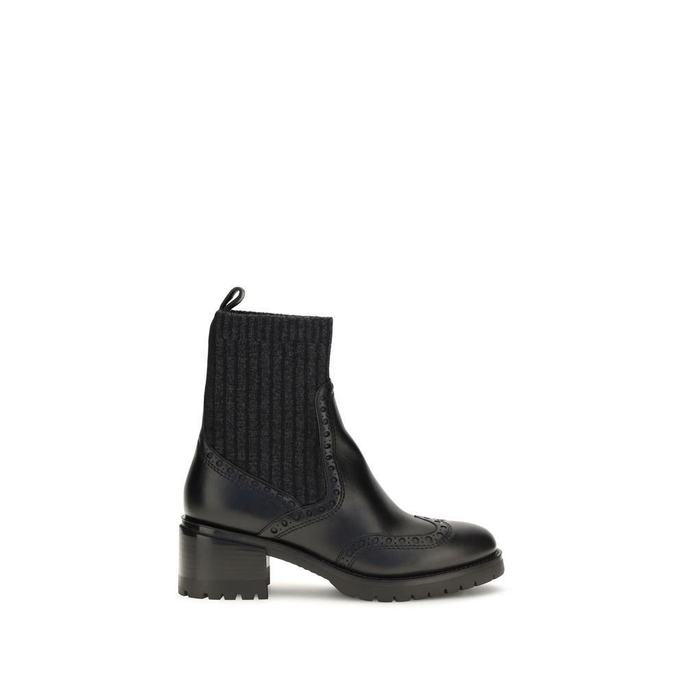 Ankle Cut-Out Boots by Santoni for women in bos taurus calfskin leather black features an high-performance silhouette, showcasing the sophisticated design of the Women's Bos Taurus Calfskin Leather Ankle Cut-Out Boots with a and a refined .