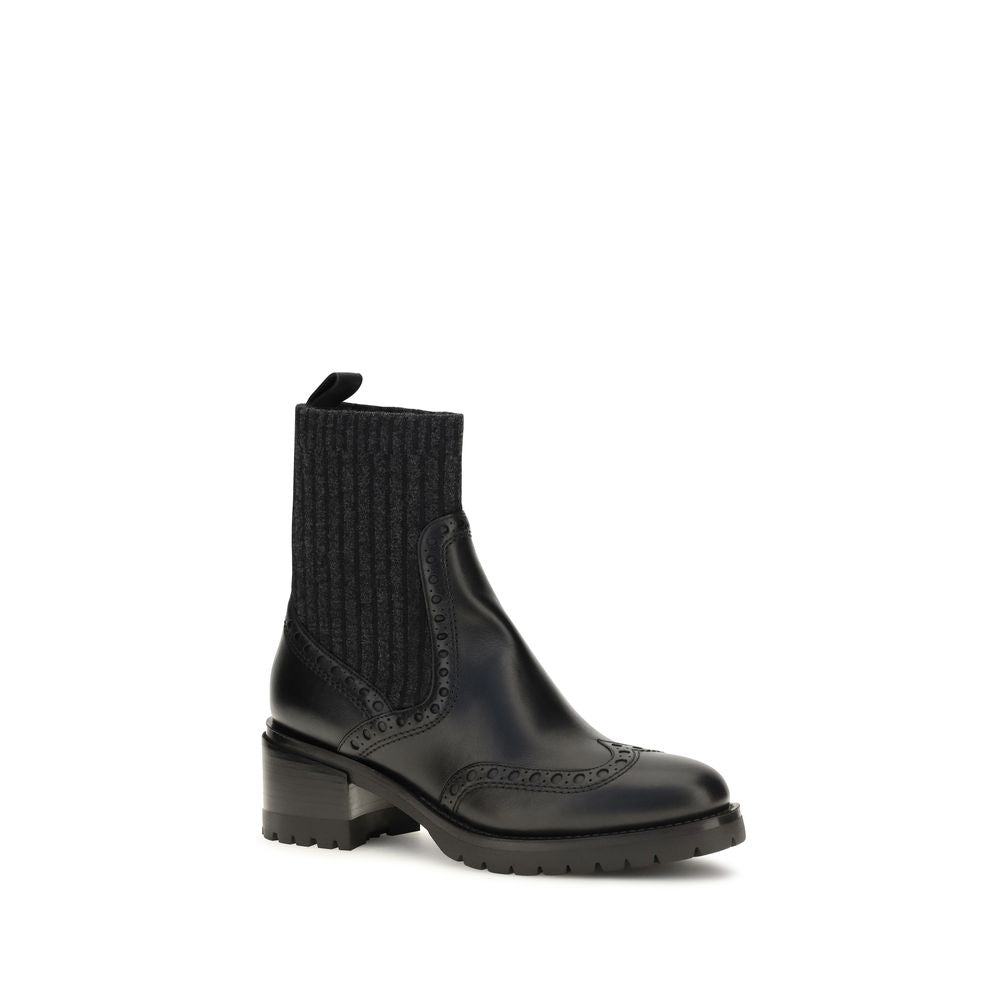 Ankle Cut-Out Boots by Santoni for women in bos taurus calfskin leather black showcases a ergonomic silhouette from the Women's Bos Taurus Calfskin Leather Ankle Cut-Out Boots collection, featuring a ergonomic and a ergonomic .