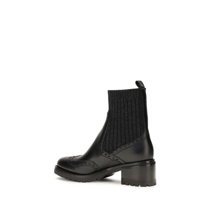 Ankle Cut-Out Boots by Santoni for women in bos taurus calfskin leather black features an dynamic silhouette, showcasing the dynamic Women's Bos Taurus Calfskin Leather Ankle Cut-Out Boots design with its distinctive and elegant .