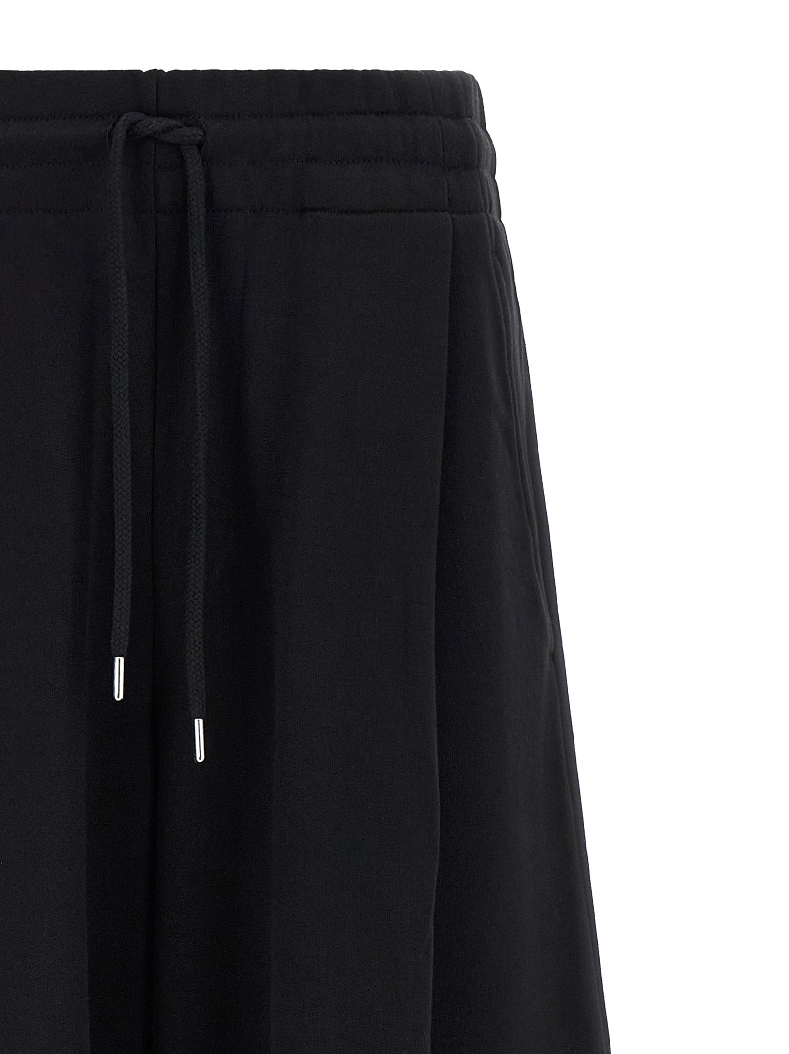 Activewear Pants by Dries Van Noten for women in cotton black & silver features an streamlined design with , highlighting a streamlined athletic & flared and long cut with a comfortable .