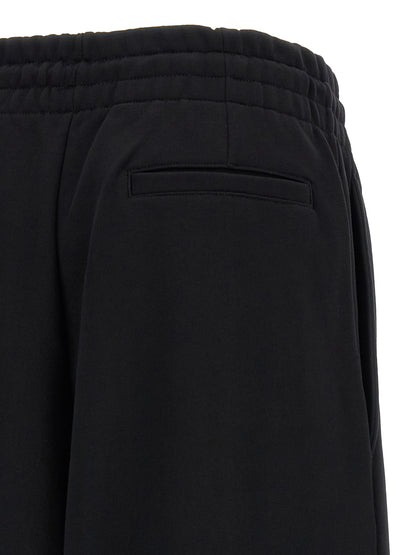 Activewear Pants by Dries Van Noten for women in cotton black & silver features an sporty athletic & flared with a long and , expertly finished with for an sporty performance aesthetic.