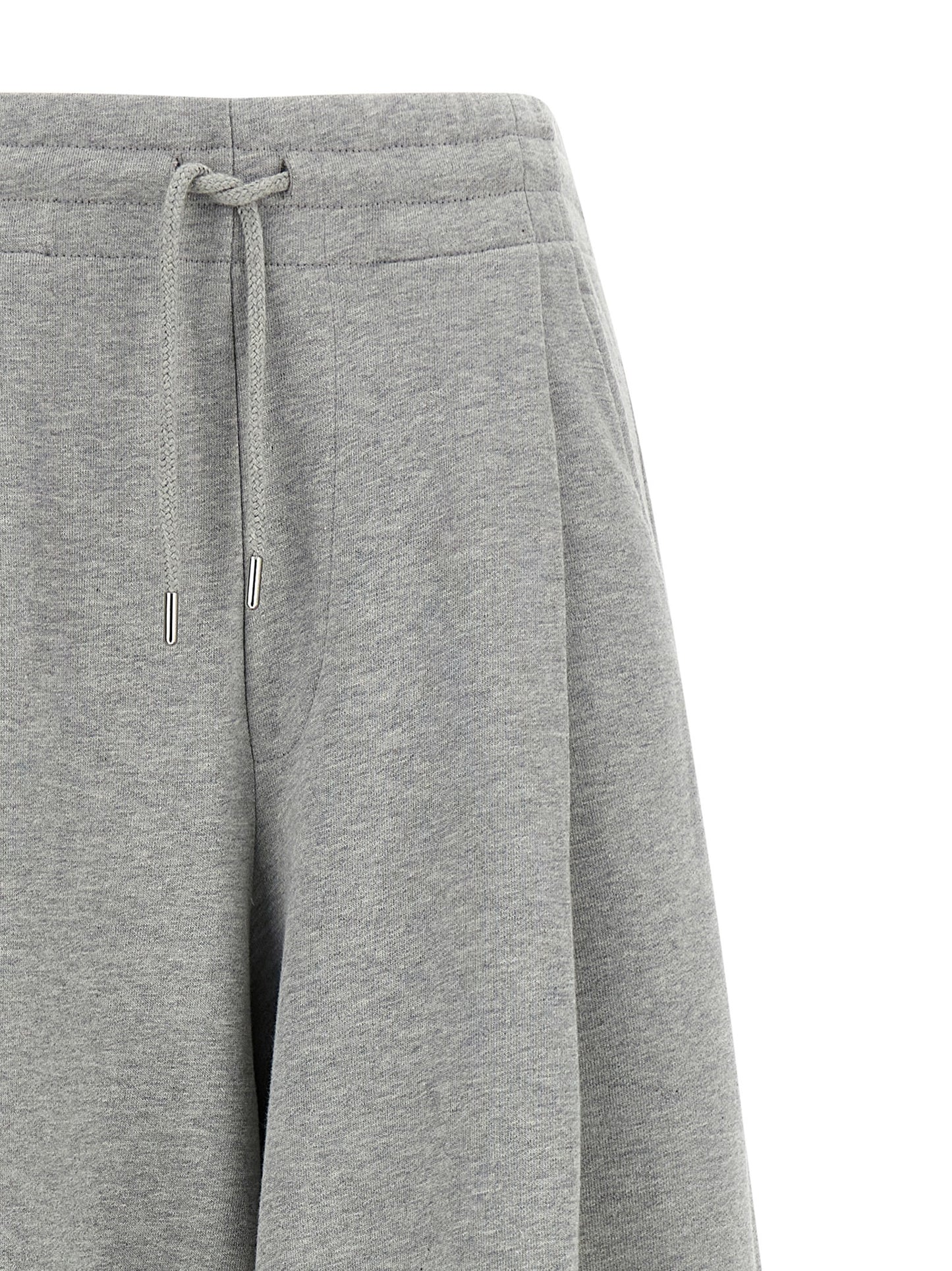 Casual Pants by Dries Van Noten for women in cotton gray & silver presents a tailored silhouette, showcasing a tailored wide and long cut with a refined mid rise for a truly tailored aesthetic.