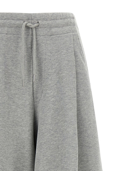 Casual Pants by Dries Van Noten for women in cotton gray & silver presents a tailored silhouette, showcasing a tailored wide and long cut with a refined mid rise for a truly tailored aesthetic.