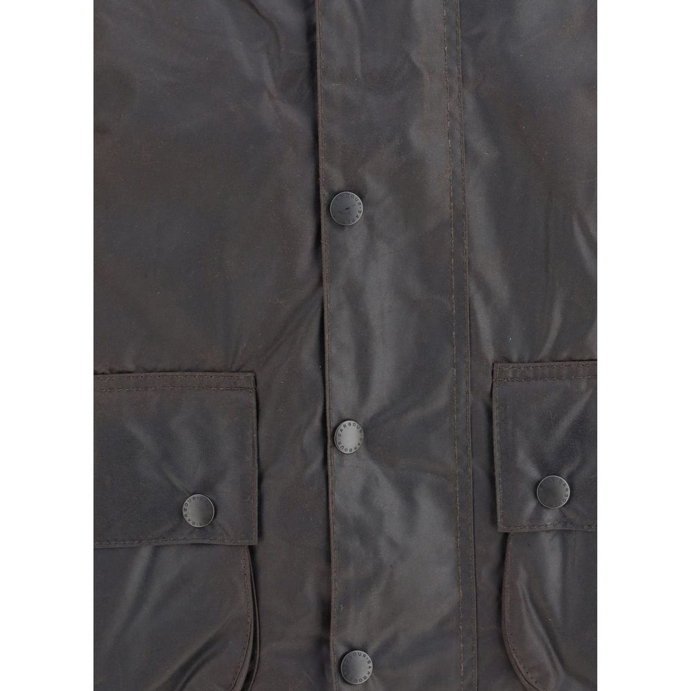 Hooded Overcoat by Barbour for men in cotton corduroy black features an voluminous silhouette, showcasing distinct pockets & hooded and a voluminous hooded neckline for a truly voluminous aesthetic.