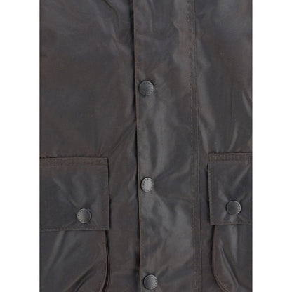 Hooded Overcoat by Barbour for men in cotton corduroy black features an voluminous silhouette, showcasing distinct pockets & hooded and a voluminous hooded neckline for a truly voluminous aesthetic.