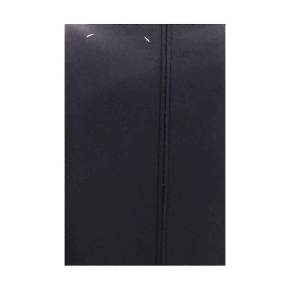 Dress by Maison Margiela for women in virgin wool black & signature features an eye catching silhouette with a sophisticated , elegant , and a refined midi for a eye catching aesthetic.