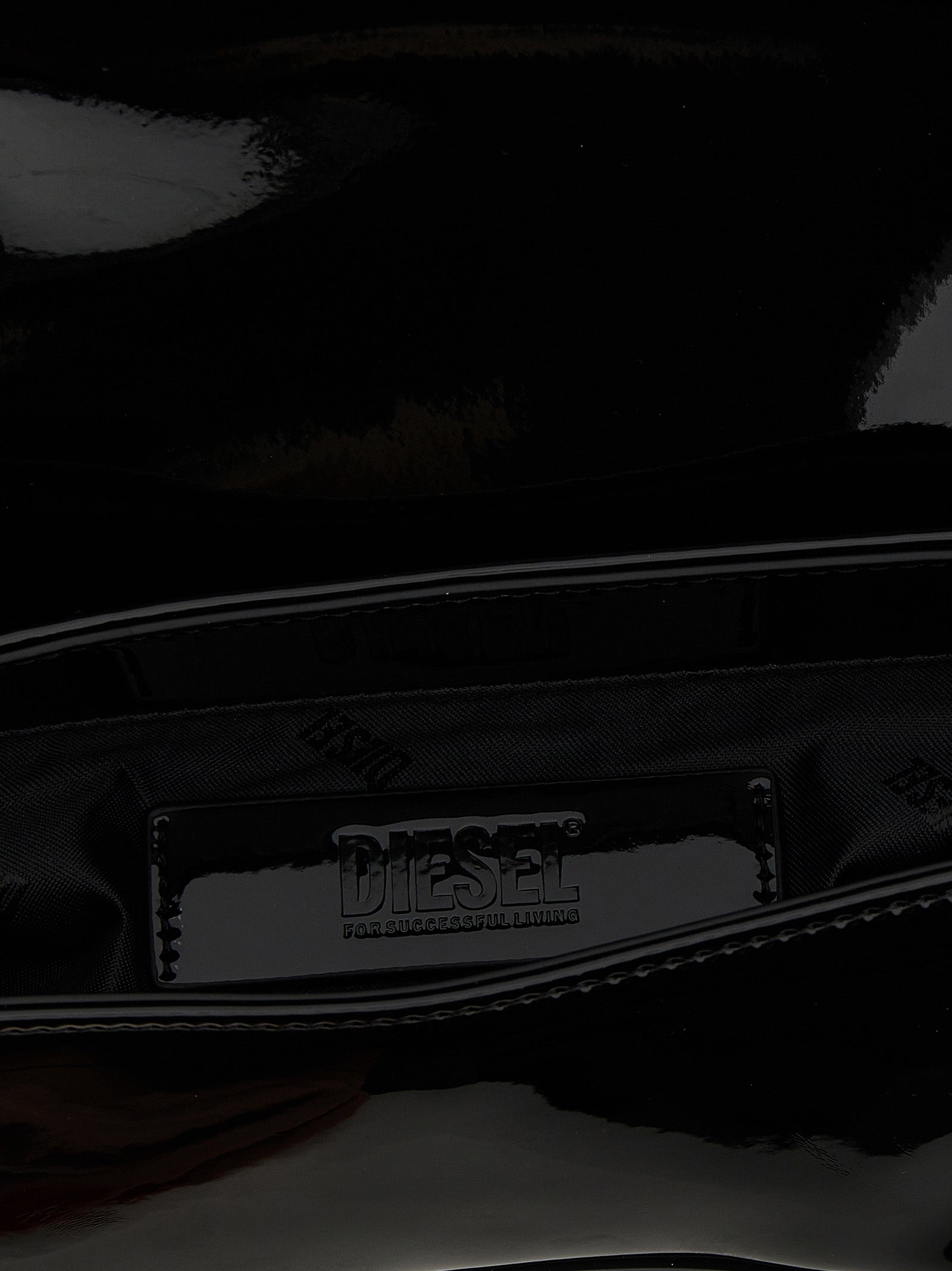 2-in-1 Shoulder & Crossbody Flap Bag by Diesel for women in polyethylene & polyurethane black features a effortless sophistication silhouette, secured by a flap & magnetic with ample and versatile crossbody-strap, shoulder-strap, adjustable-strap & handle for a effortless sophistication finish.