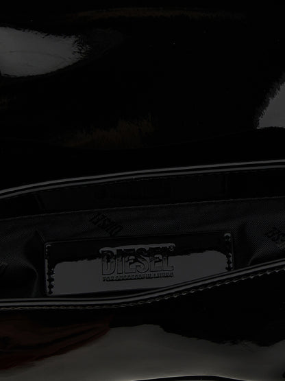 2-in-1 Shoulder & Crossbody Flap Bag by Diesel for women in polyethylene & polyurethane black features a effortless sophistication silhouette, secured by a flap & magnetic with ample and versatile crossbody-strap, shoulder-strap, adjustable-strap & handle for a effortless sophistication finish.