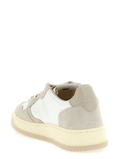 Sneakers by Autry for men in bos taurus suede cowhide leather cream, gray, light-grey, white & signature features an fashionable silhouette, showcasing the premium Essence Men's Low Top Tennis Bos Taurus Suede Cowhide Leather Sneakers in a fashionable low-top tennis style that offers a fashionable finish for refined style.