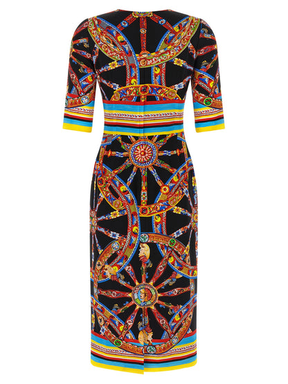 Dress by Dolce & Gabbana for women in silk black, multicolor, print & striped features a dramatic silhouette, showcasing an elegant round neckline and that flows into a dramatic midi.
