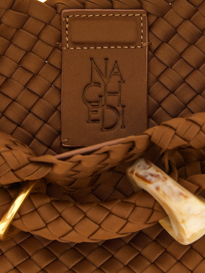 This Small Clutch Handbag by NAGHEDI for women in leather & neoprene and brown presents a sculptural silhouette featuring a secure , ample , and versatile shoulder-strap & handle for a sculptural finish.