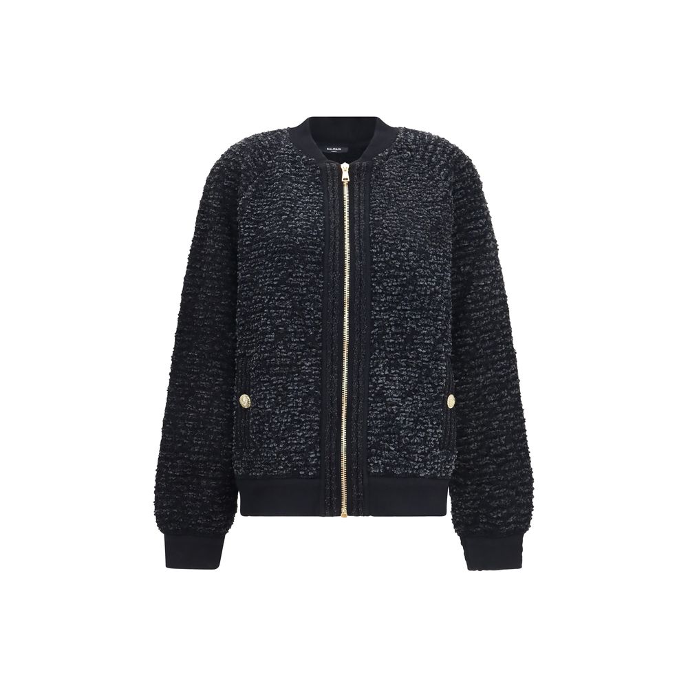Bomber Jacket by Balmain for women in merino wool nylon polyester cotton & lyocell black features an contemporary silhouette, showcasing a sophisticated and contemporary pockets for a truly refined look.