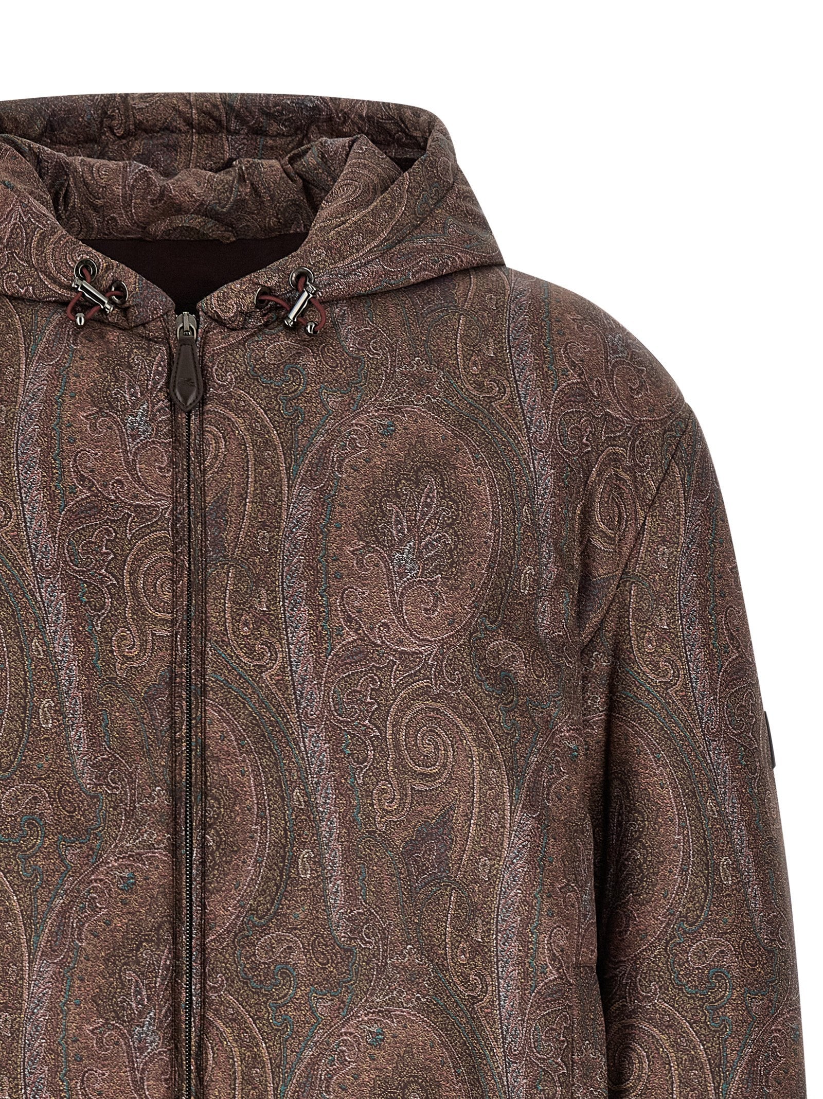 This Hooded Bomber Jacket by Etro for men in polyester brown, patterned & paisley exhibits a edgy silhouette, meticulously detailed with functional hooded and a edgy hooded neckline for a edgy finish.