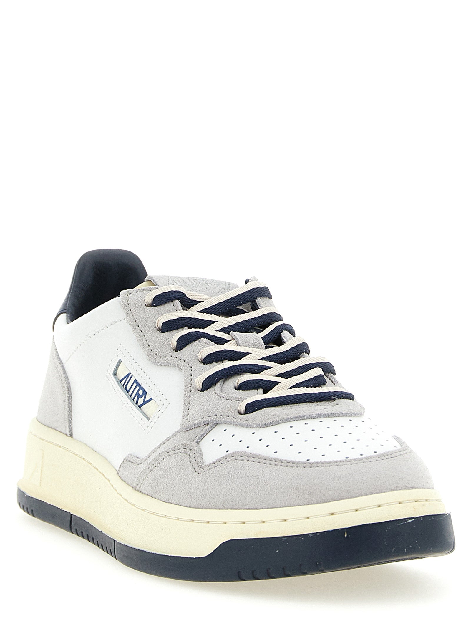 Athletic Sneakers by Autry for men in cotton & cowhide suede leather multicolor & navy presents a sleek silhouette, perfectly capturing the low-top style essence of Men's Low Top Cotton & Cowhide Suede Leather Athletic Sneakers with its sleek design and premium finish.