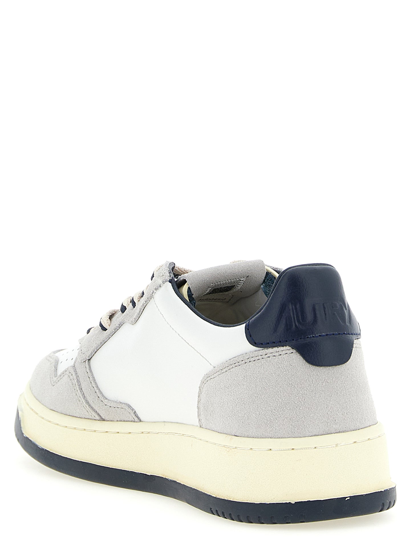 Athletic Sneakers by Autry for men in cotton & cowhide suede leather multicolor & navy features an effortless chic silhouette, showcasing the signature low-top style of the Men's Low Top Cotton & Cowhide Suede Leather Athletic Sneakers collection with a truly effortless chic finish.