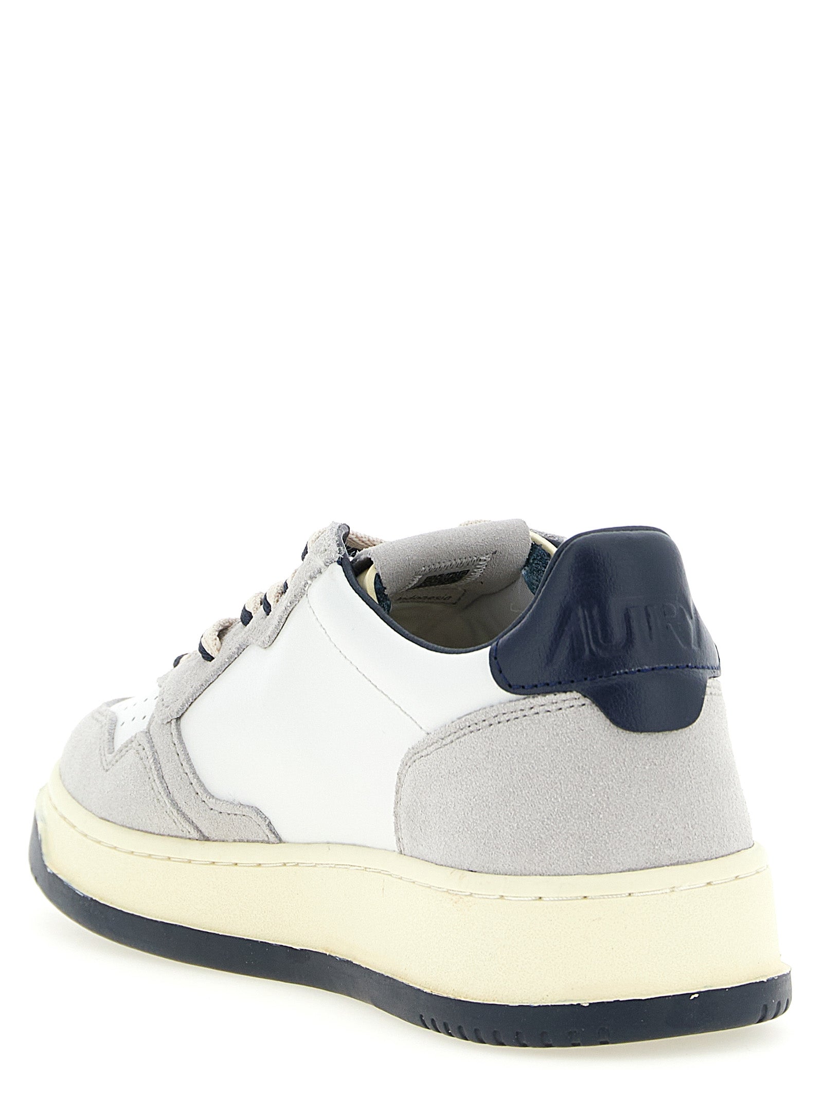 Athletic Sneakers by Autry for men in cotton & cowhide suede leather multicolor & navy features an effortless chic silhouette, showcasing the signature low-top style of the Men's Low Top Cotton & Cowhide Suede Leather Athletic Sneakers collection with a truly effortless chic finish.