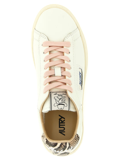Sneakers by Autry for women in cowhide python leather multicolor & pink features an fashionable silhouette, showcasing the premium Women's Low Top Cowhide Python Leather Sneakers in a fashionable low-top style that offers a fashionable finish for refined style.