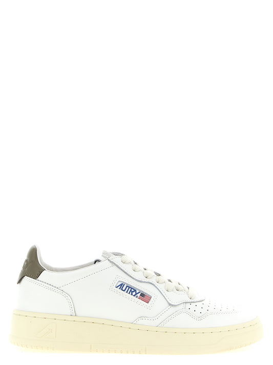 Sneakers by Autry for women in cotton & cowhide leather bicolour, cream, green, white & signature presents a on trend silhouette from the Women's Low Top Cotton & Cowhide Leather Sneakers collection, showcasing a on trend low-top style for an elevated aesthetic.