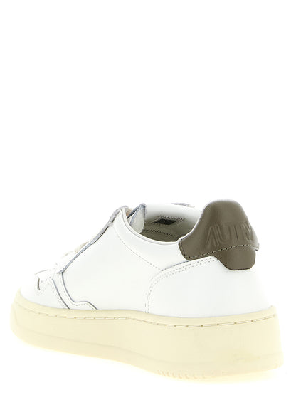 Sneakers by Autry for women in cotton & cowhide leather bicolour, cream, green, white & signature features an versatile design from the Women's Low Top Cotton & Cowhide Leather Sneakers collection, highlighting a versatile low-top style for a premium, high-fashion look.