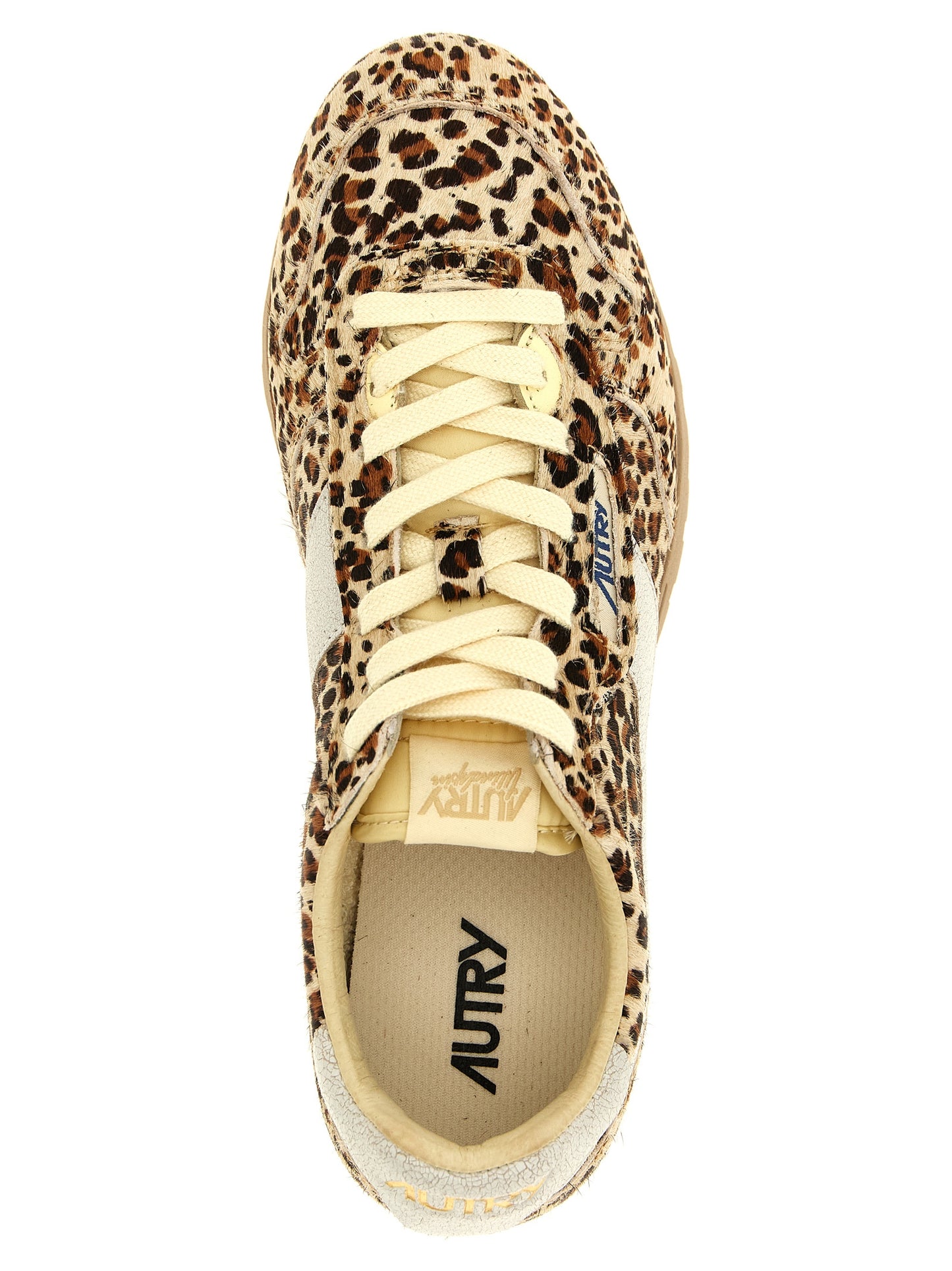 Sneakers by Autry for women in bos taurus cowhide leather gold, multicolor & print presents a sumptuous silhouette, artfully capturing the essence of the Pony Women's Low Top Bos Taurus Cowhide Leather Sneakers with its sumptuous low-top style design.
