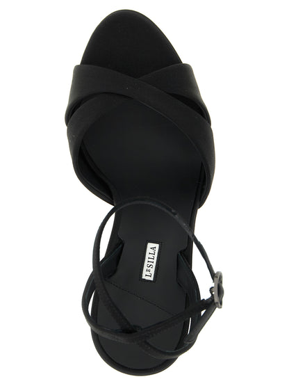 Platform Stiletto Ankle Strap Sandals by LE SILLA for women in viscose silk & leather black presents a sculptural silhouette, showcasing the Women's Viscose Silk & Leather Platform Stiletto Ankle Strap Sandals design with a sculptural stiletto platform and for a premium look.