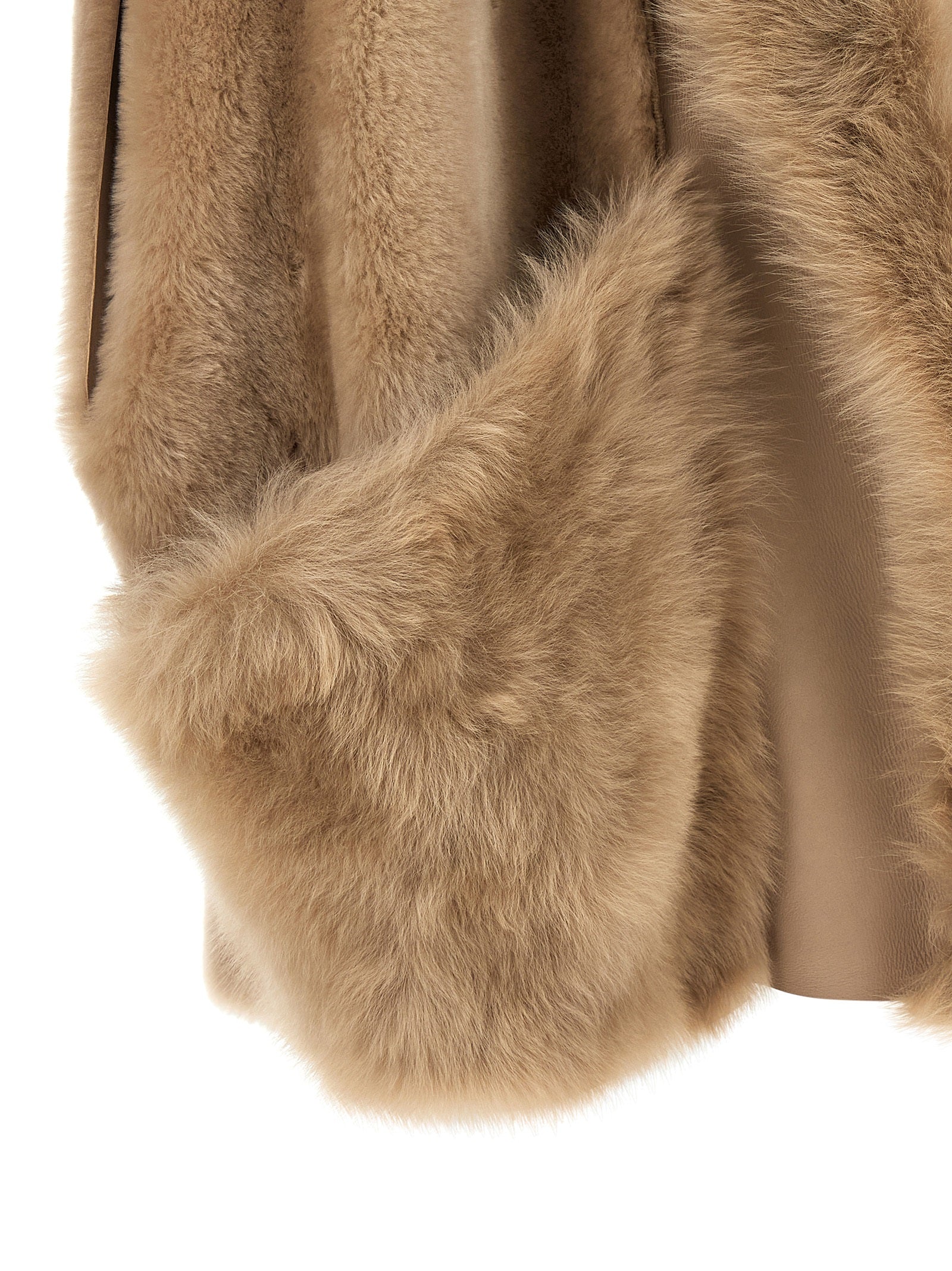 Vest by BLANCHA for women in lamb shearling beige & hazelnut showcases a utilitarian silhouette, artfully incorporating pockets and a utilitarian for a truly utilitarian finish.