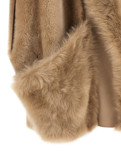 Vest by BLANCHA for women in lamb shearling beige & hazelnut showcases a utilitarian silhouette, artfully incorporating pockets and a utilitarian for a truly utilitarian finish.