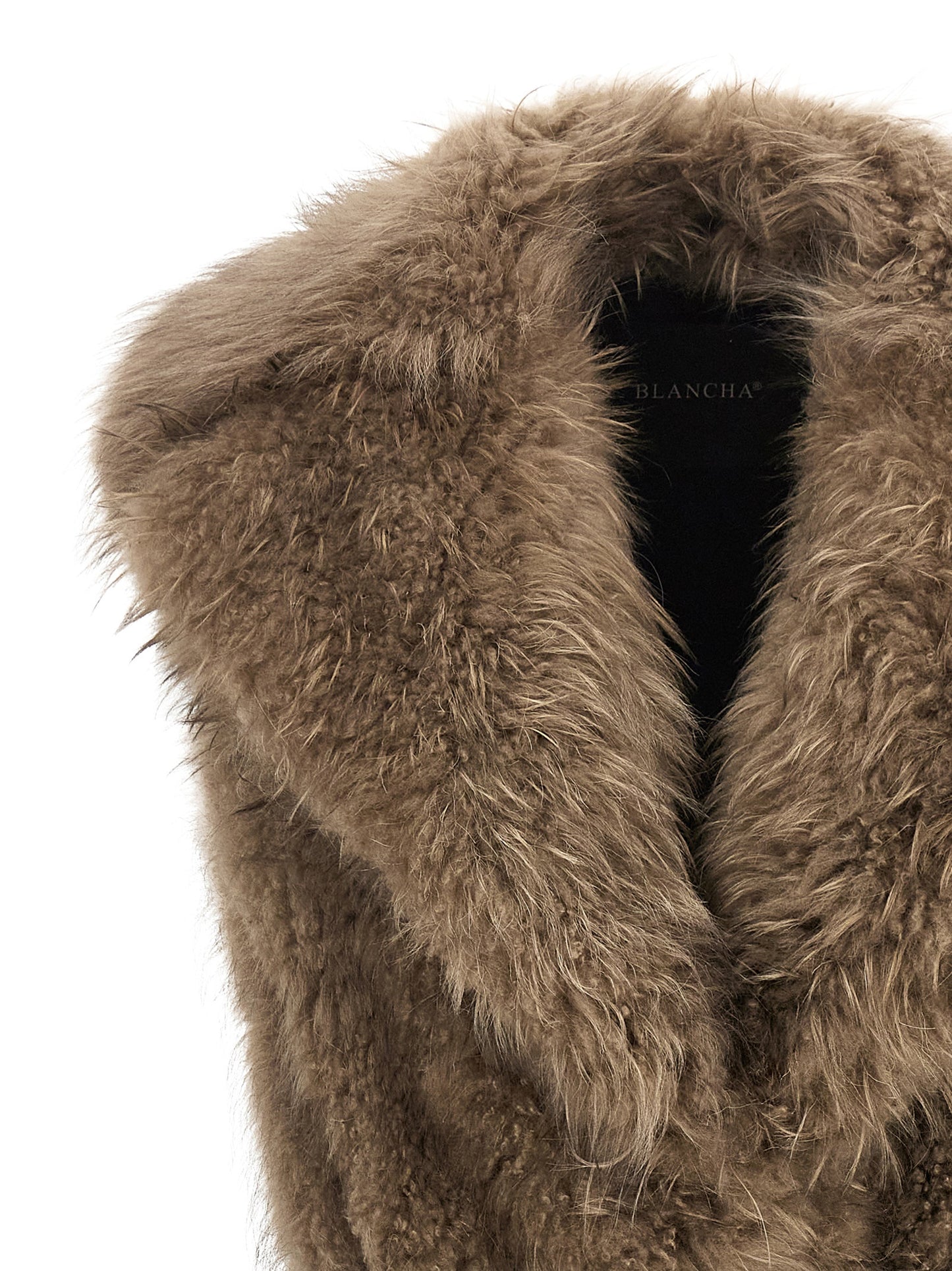 Vest by BLANCHA for women in cashmere goat leather & lamb shearling beige, black & natural showcases a utilitarian silhouette, artfully incorporating and a utilitarian shawl-collar neckline for a truly utilitarian finish.
