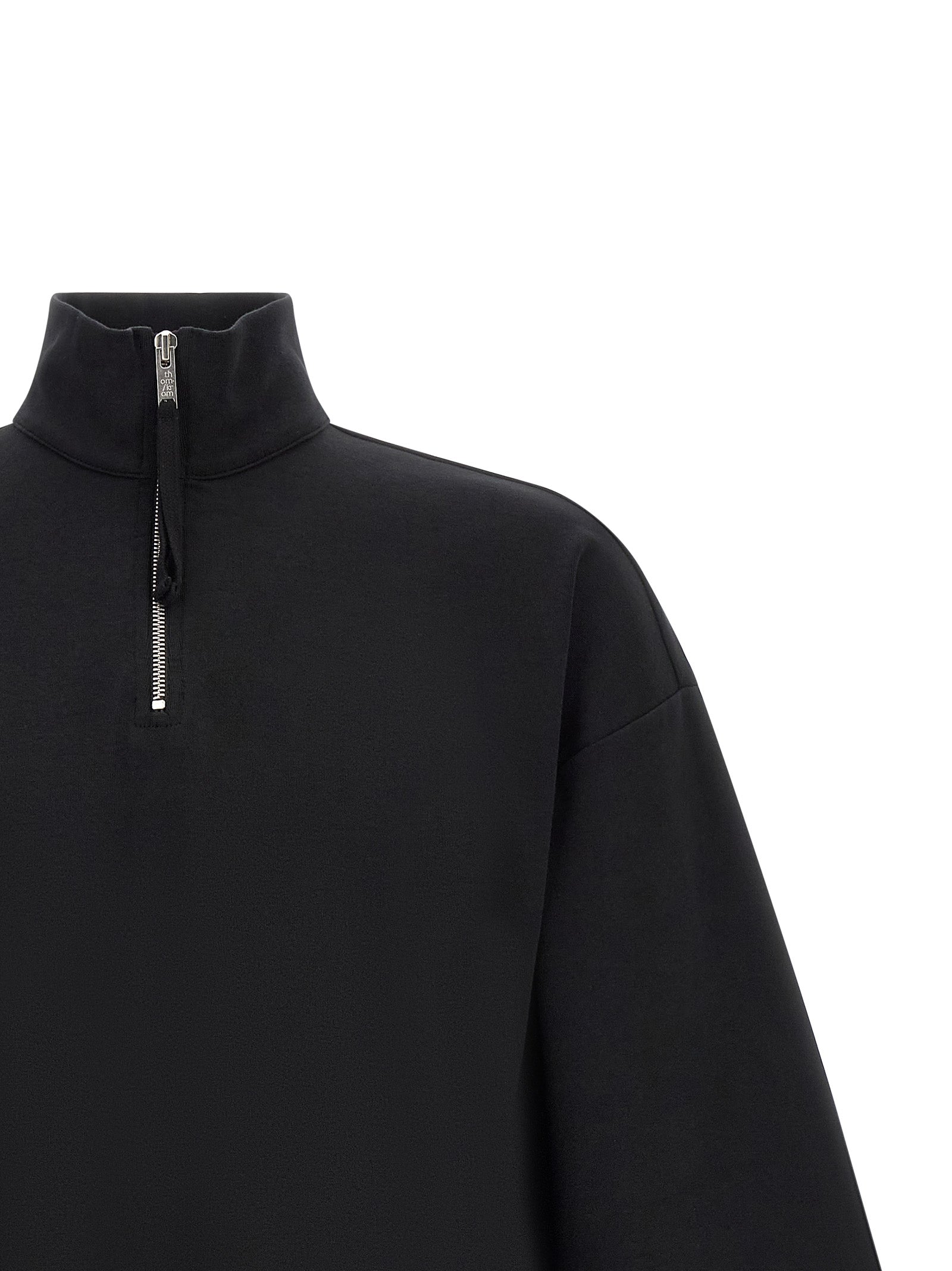 Sweatshirt by Thom Krom for men in organic cotton black & silver showcases a slouchy chic silhouette, artfully detailed with a slouchy chic high-neck neckline and for a slouchy chic finish.